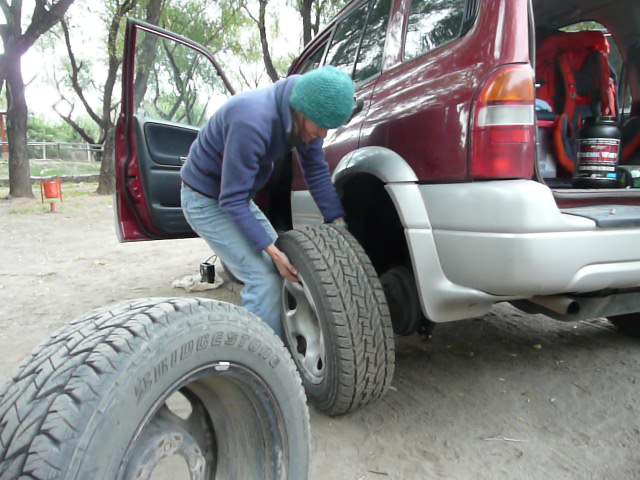 Julia changing a tire like a pro