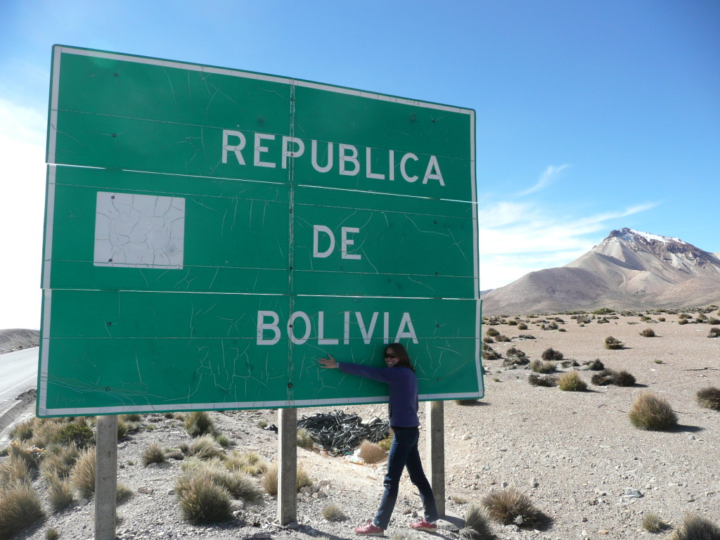 Julia trying to hug the Bolivia sign