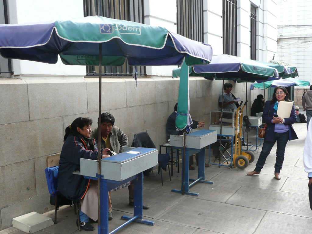 We saw these everywhere in Sucre, and they are for people to come along and get some business admin done by the people at the desks.
