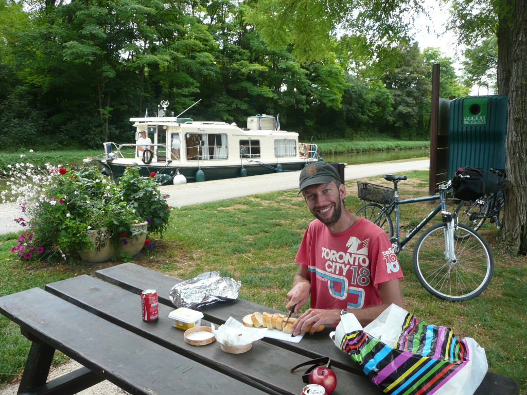 Richard making us a picnic lunch: cheese on baguette.