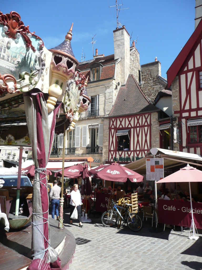 A plaza where we ate lunch in Dijon, colourful, with lots of different things going on.